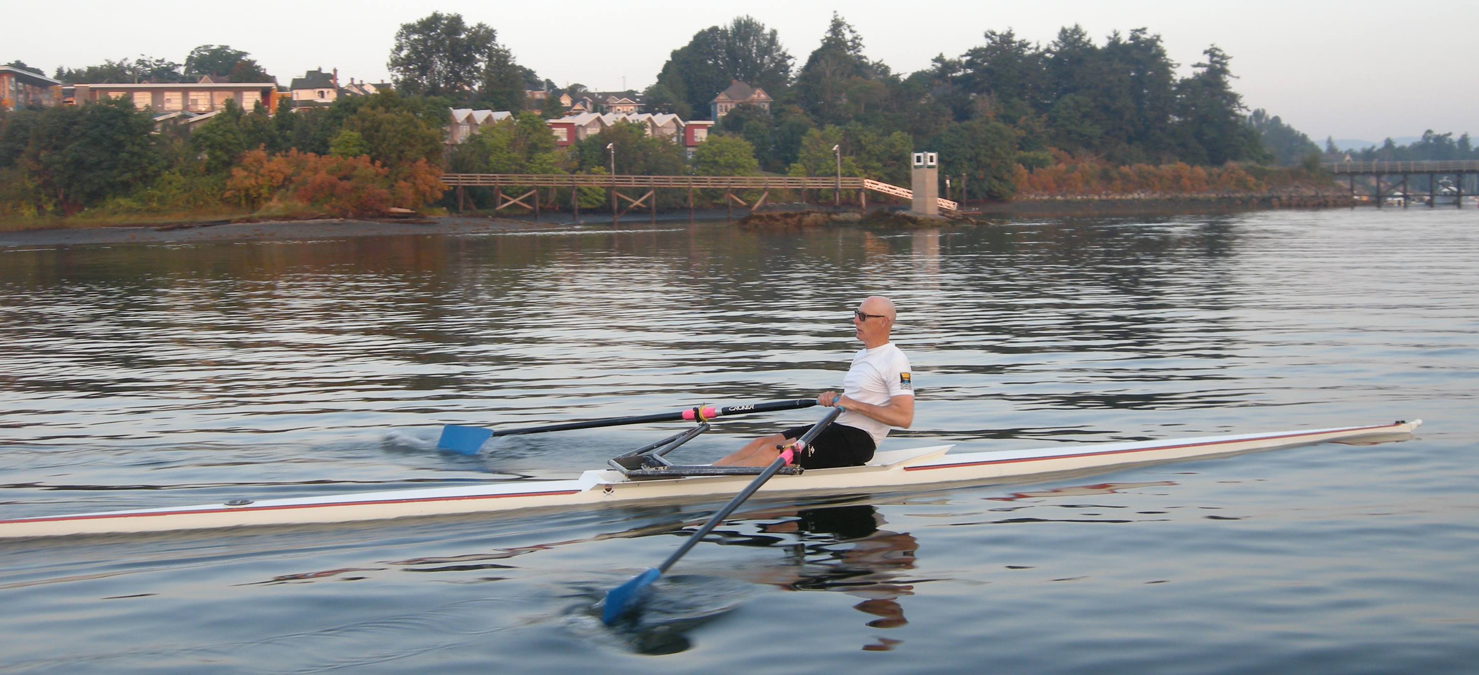 Frank Rudge rowing a single scull on the water in Victoria BC